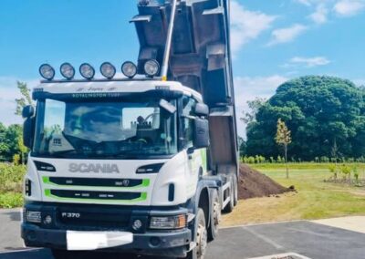 About us Screened Topsoil being tipped